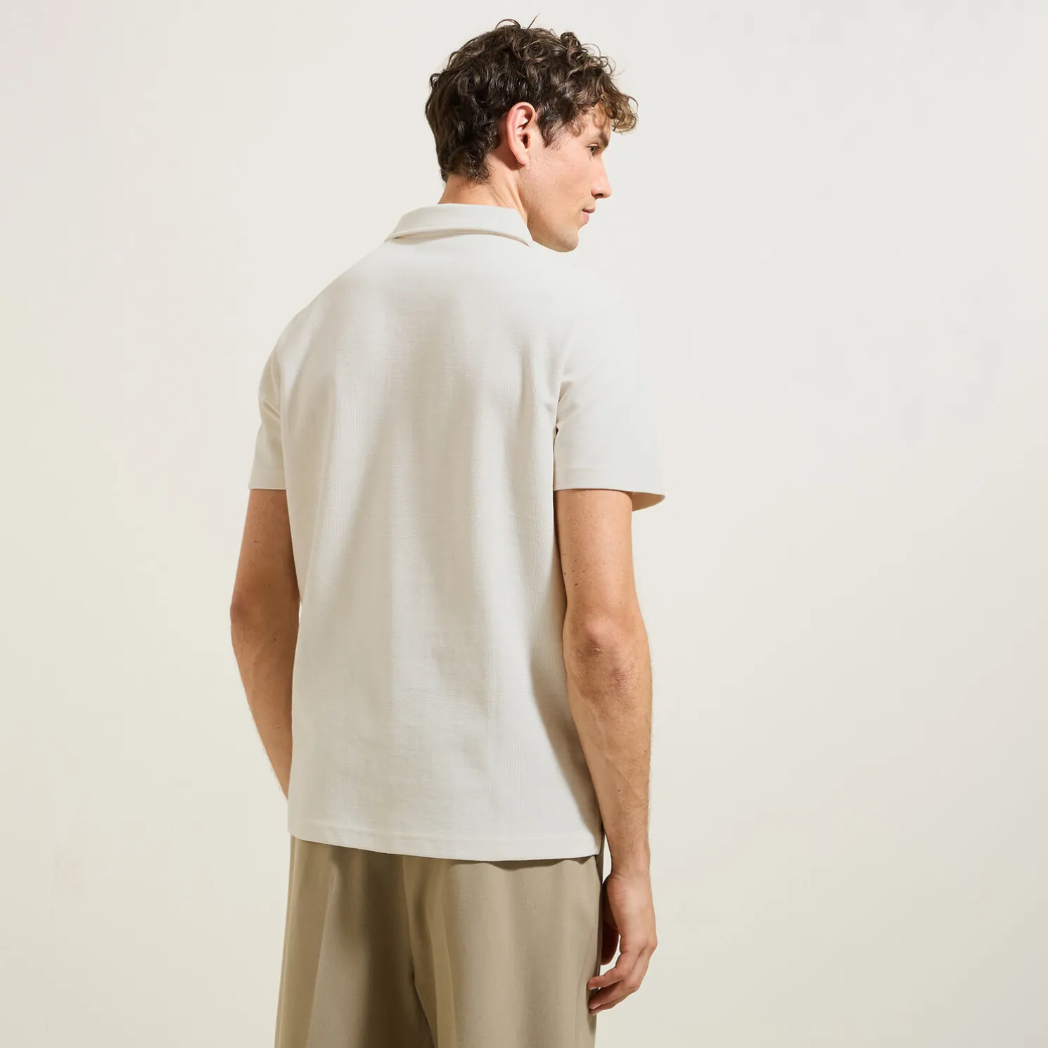 Effen relaxed polo met korte mouwen in textuurstof