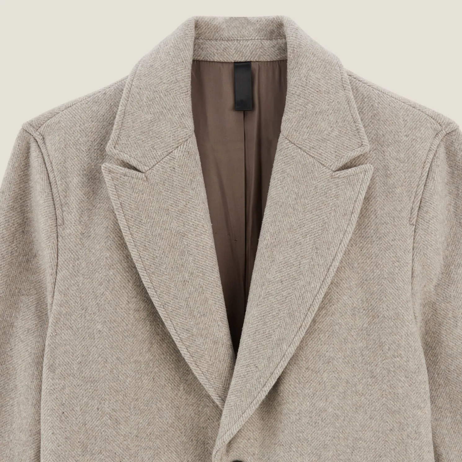 Lange mantel met visgraatmotief en reverskraag