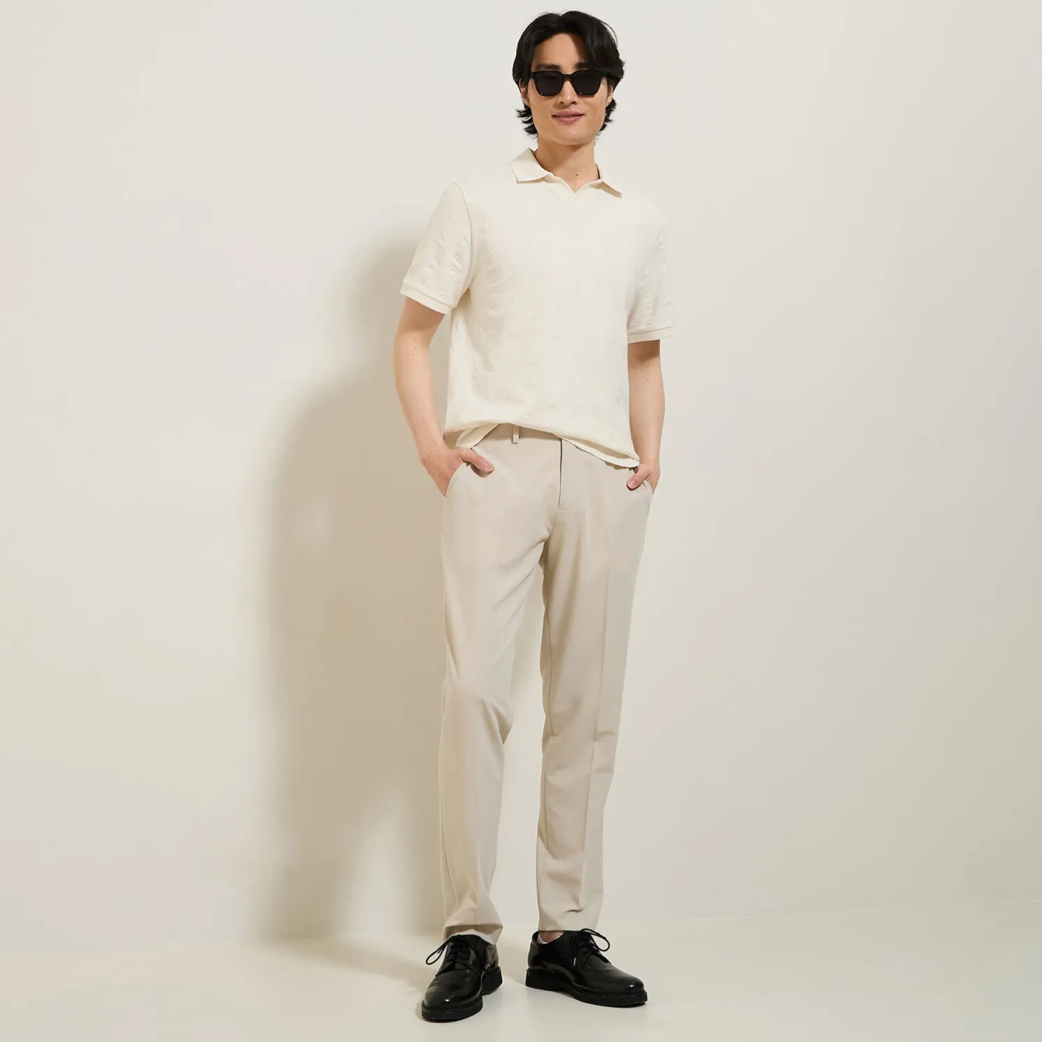 Polo in textuurstof met korte mouwen en resortkraa