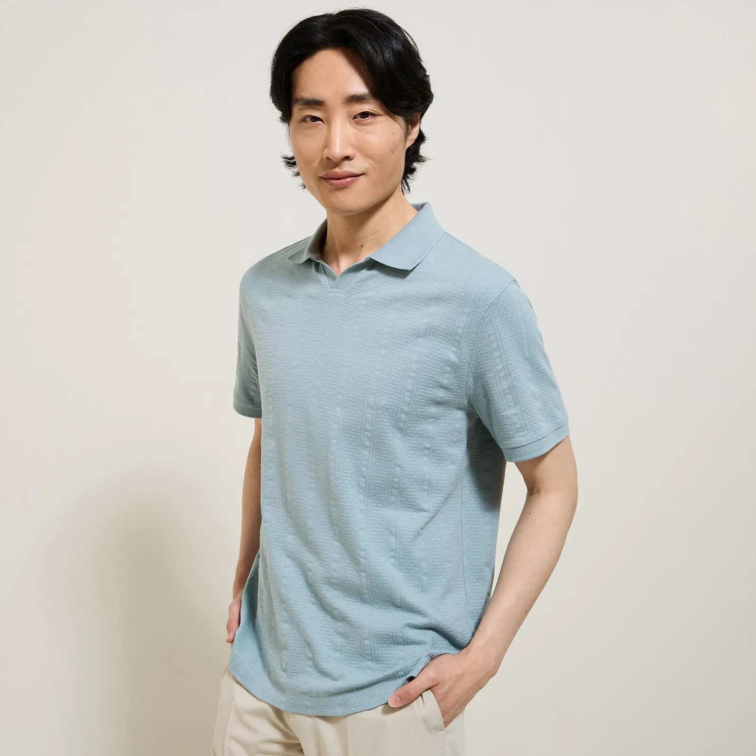 Polo in textuurstof met korte mouwen en resortkraa