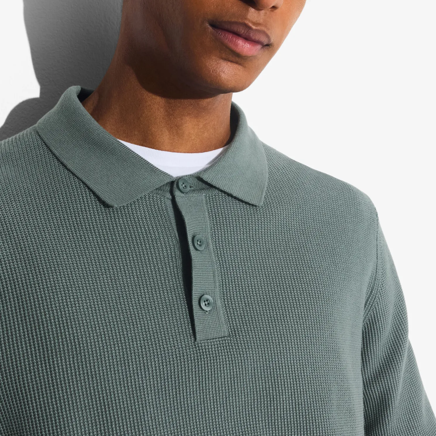 Polo met knopen in textuurstof