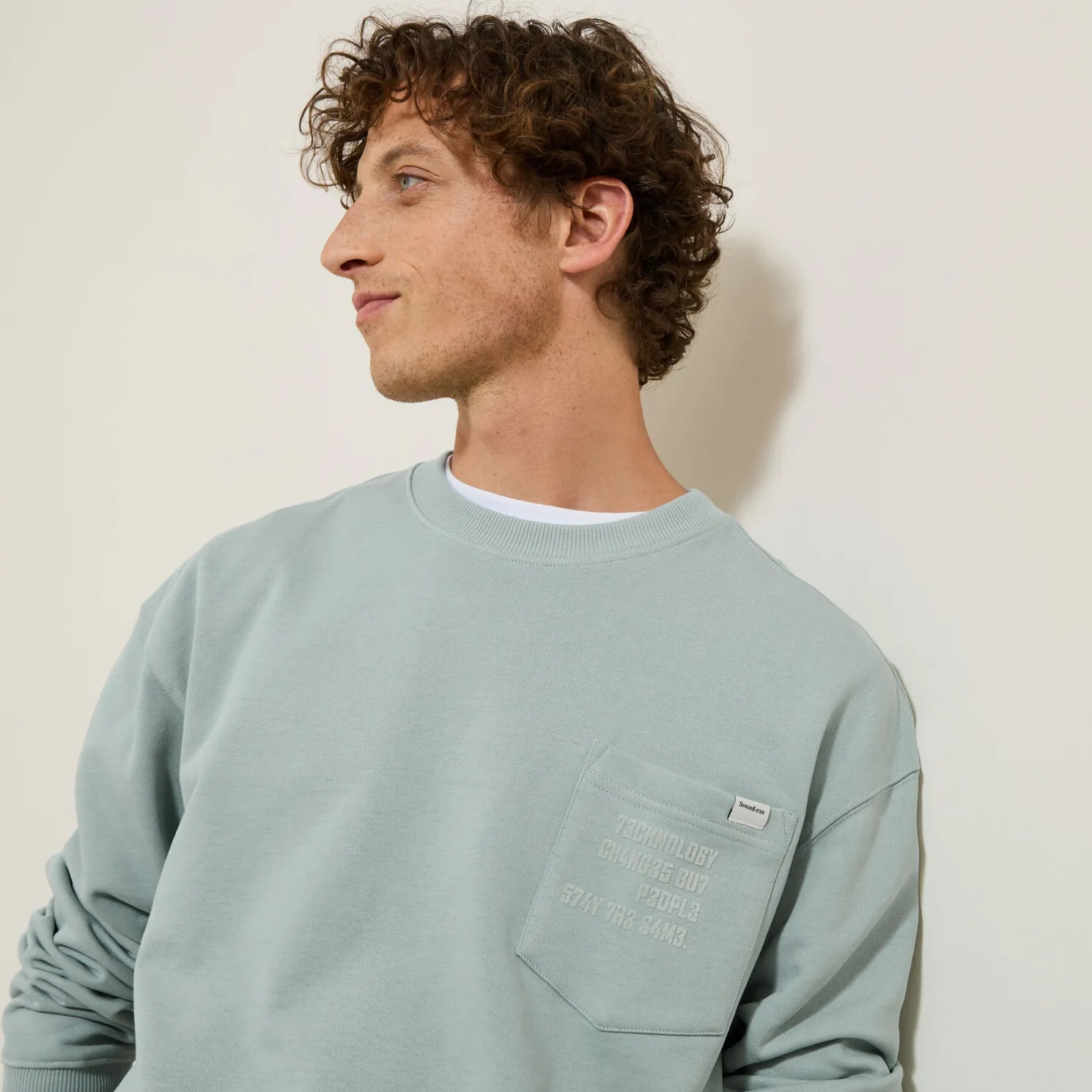 Sweater ronde hals, zak en afbeelding